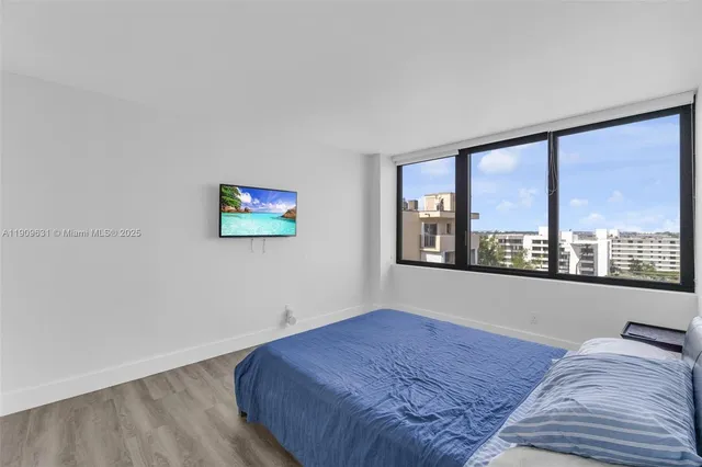 a bedroom with a bed and a table