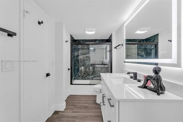 a bathroom with a bathtub and a shower