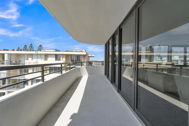 a view of balcony with furniture