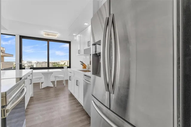 a kitchen with counter top space and stainless steel appliances