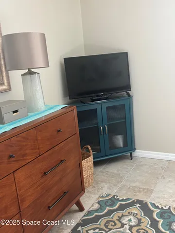 a room with a dresser and a couch