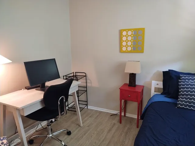 a workspace with furniture and wooden floor