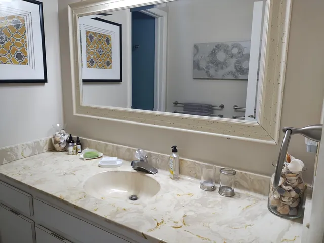 a bathroom with a sink and a mirror