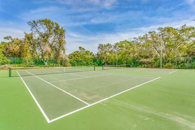 a view of an outdoor space and tennis court