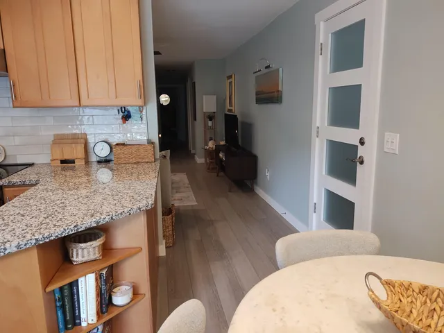 a living room with granite countertop furniture and a fireplace