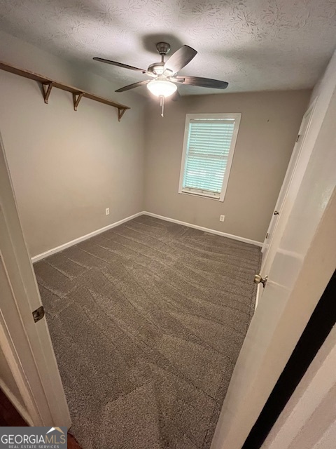 1221 Martin Nash Road Southwest Lilburn, GA 30047 - Photo 20 of 31 a view of a room with a ceiling fan and a window