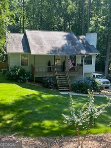 1221 Martin Nash Road Southwest Lilburn, GA 30047 - Photo 2 of 31 a view of a house with a garden