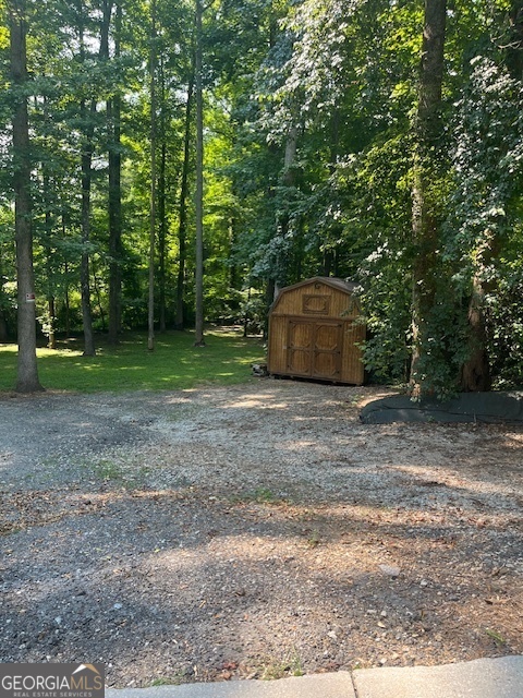 1221 Martin Nash Road Southwest Lilburn, GA 30047 - Photo 3 of 31 a view of a outdoor space