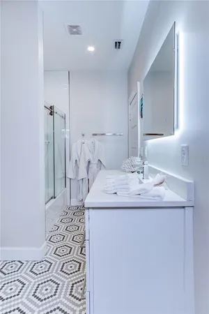 a bathroom with a sink and a mirror