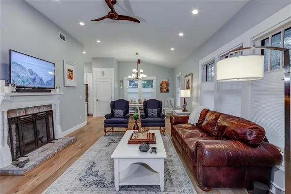a living room with furniture and a fireplace