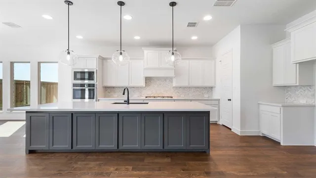 a view of a room with large windows and pool table
