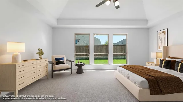 a spacious bedroom with a bed and large window