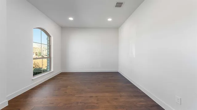 an empty room with windows