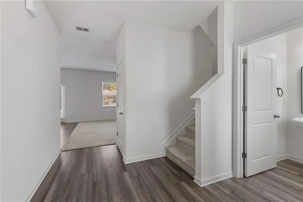 a view of entryway with wooden floor