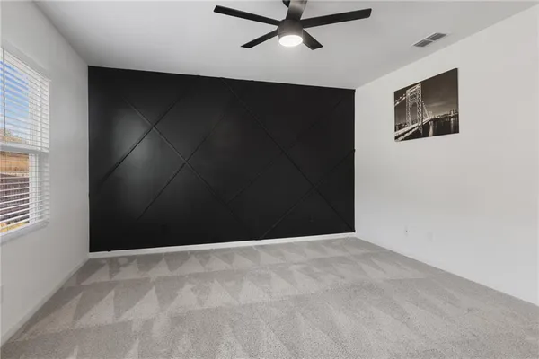 a view of a livingroom with a flat screen tv