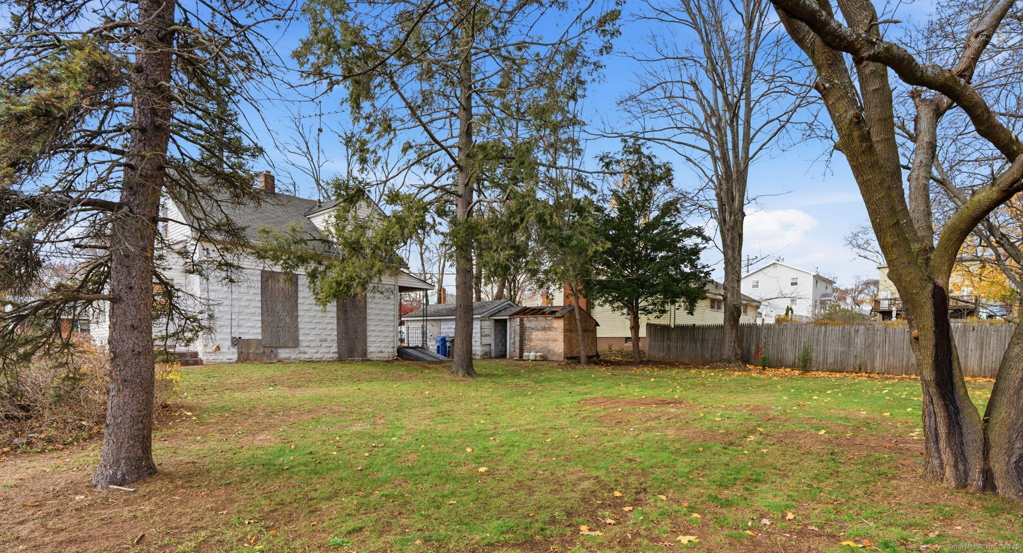 41 Windemere Street Manchester, CT 06042 - Photo 5 of 15 a view of a yard with a tree