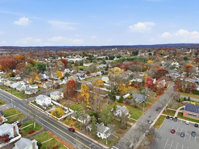 an aerial view of residential houses with outdoor space
