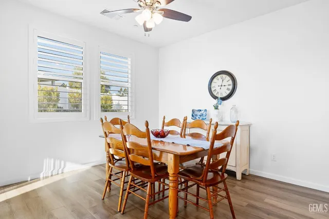 a kitchen with a sink a microwave a refrigerator and cabinets