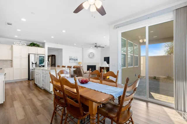 a kitchen with granite countertop white cabinets and stainless steel appliances