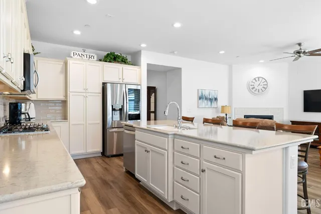 a en suite bathroom with a tub sink and mirror