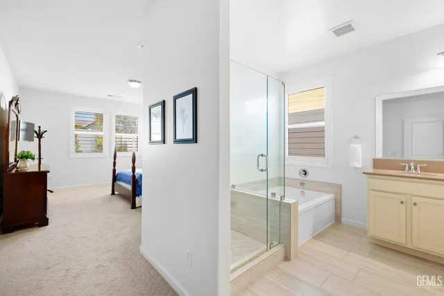 a white toilet sitting next to a bath tub