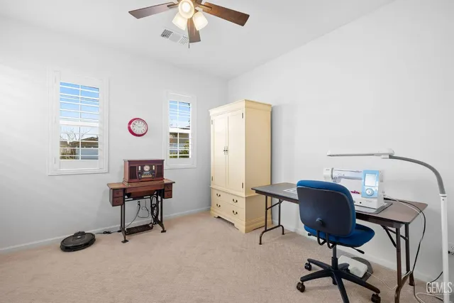 an aerial view of residential houses with city view