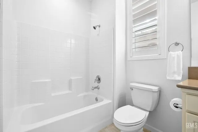 a view of a chairs and table in a patio