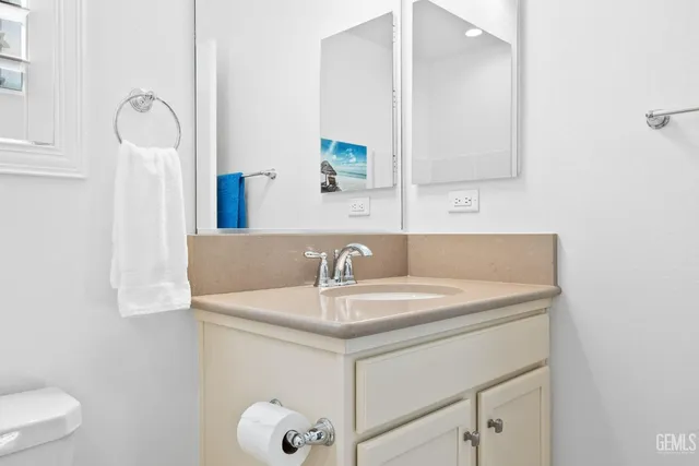 a view of a patio with table and chairs