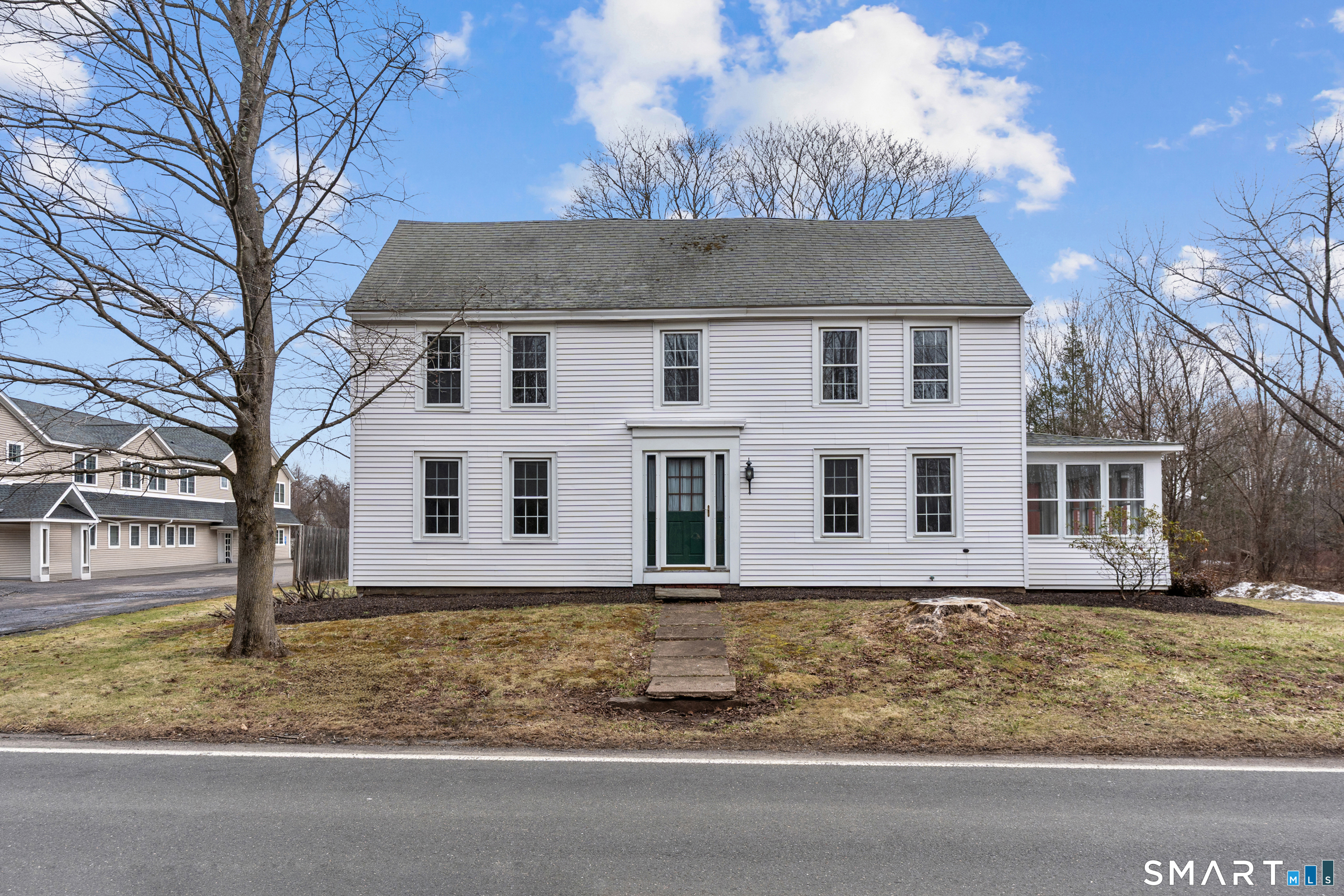 front view of a house with a yard