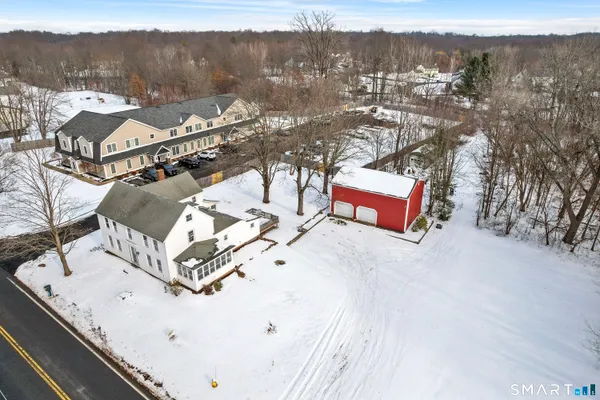 a view of kitchen with stainless steel appliances granite countertop refrigerator and cabinets