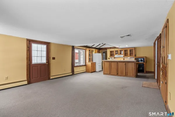 a kitchen with stainless steel appliances granite countertop a stove and a sink