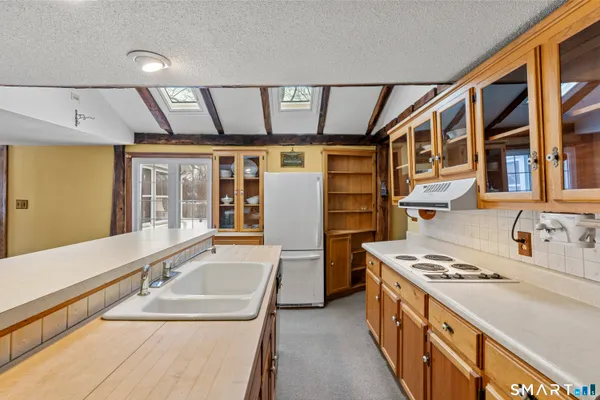a bathroom with a toilet sink and tub