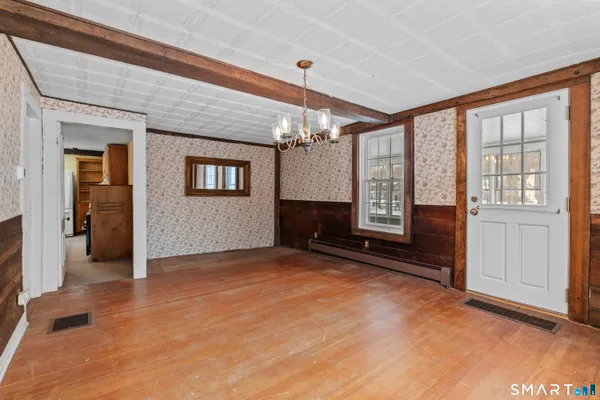 a picture of a room with a white wall and road
