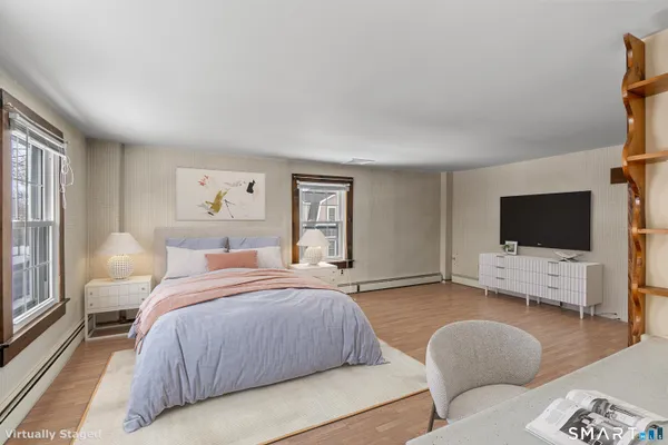 a view of white house with snow on the road