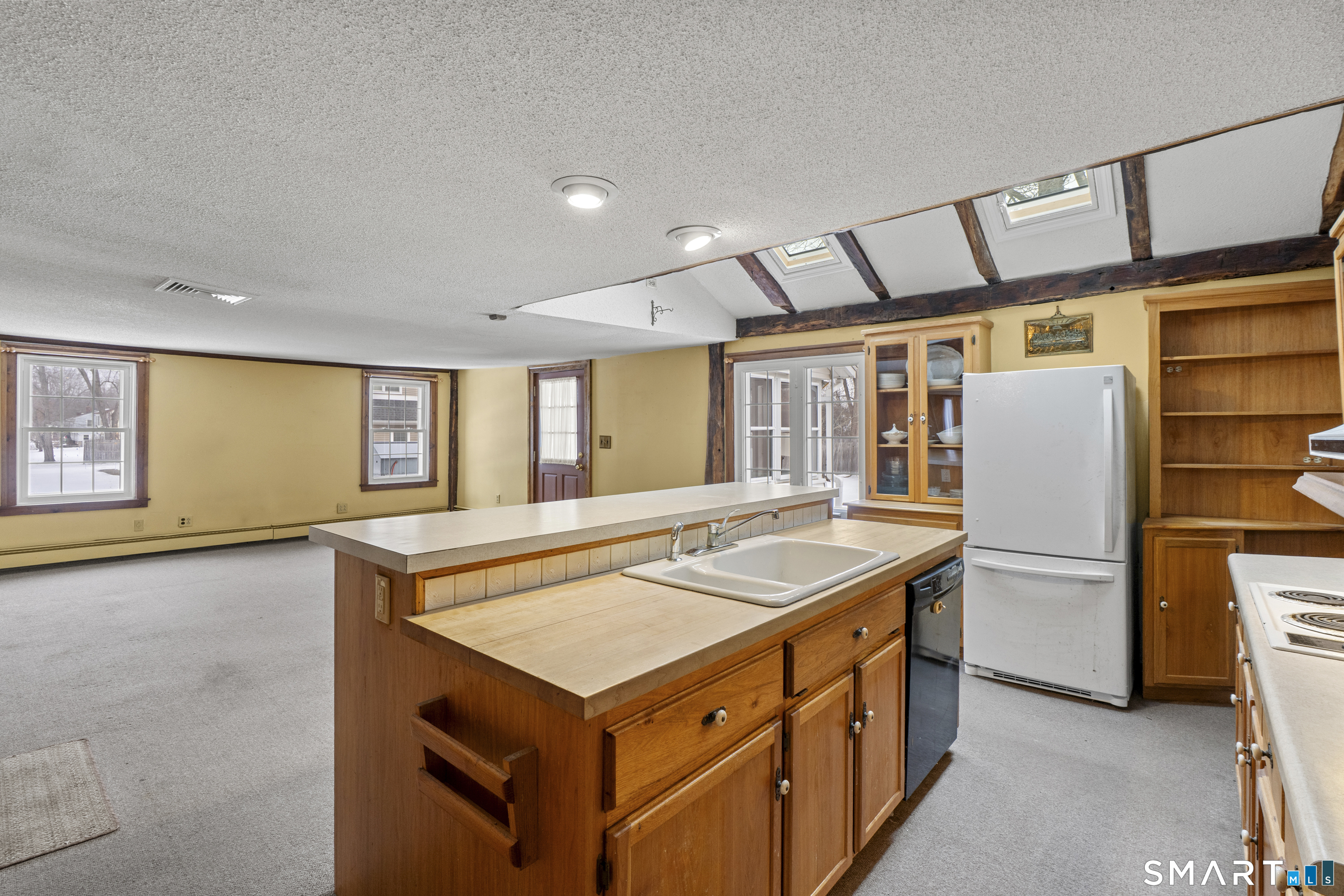 392 Boston Neck Road Suffield, CT 06078 - Photo 9 of 35 a kitchen with a stove and a refrigerator