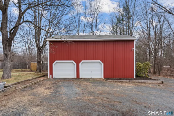 a livingroom with furniture washer and dryer