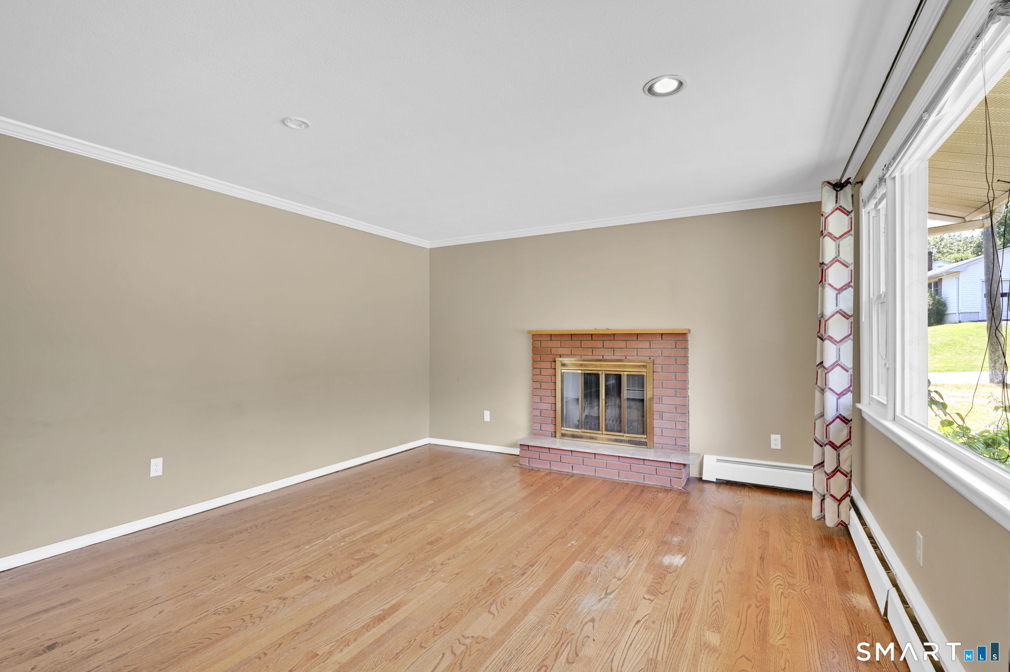 7 Rogers Drive Meriden, CT 06450 - Photo 11 of 40 an empty room with wooden floor and windows