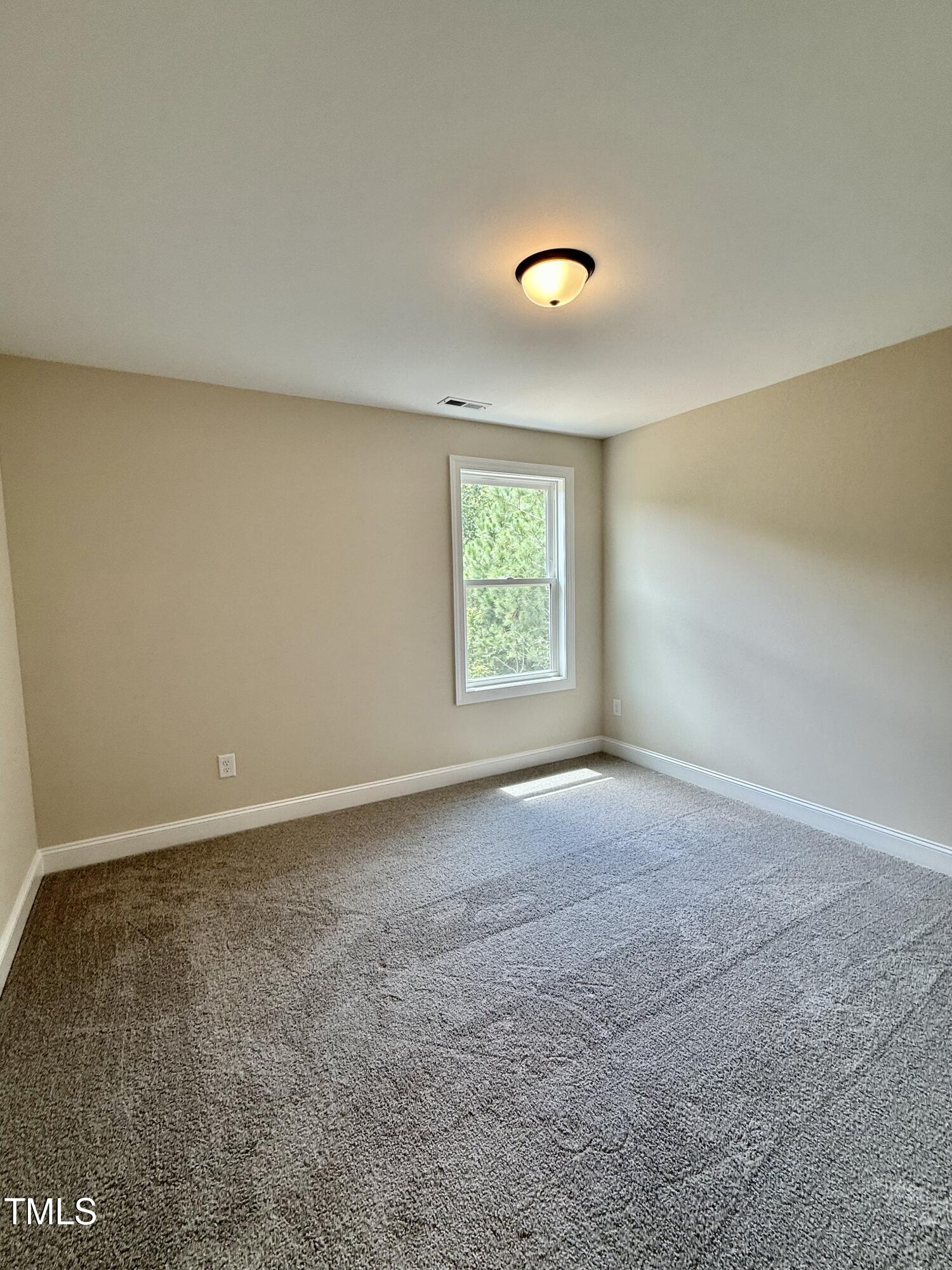 50 Moonraker Drive Spring Hope, NC 27882 - Photo 28 of 37 an empty room with windows