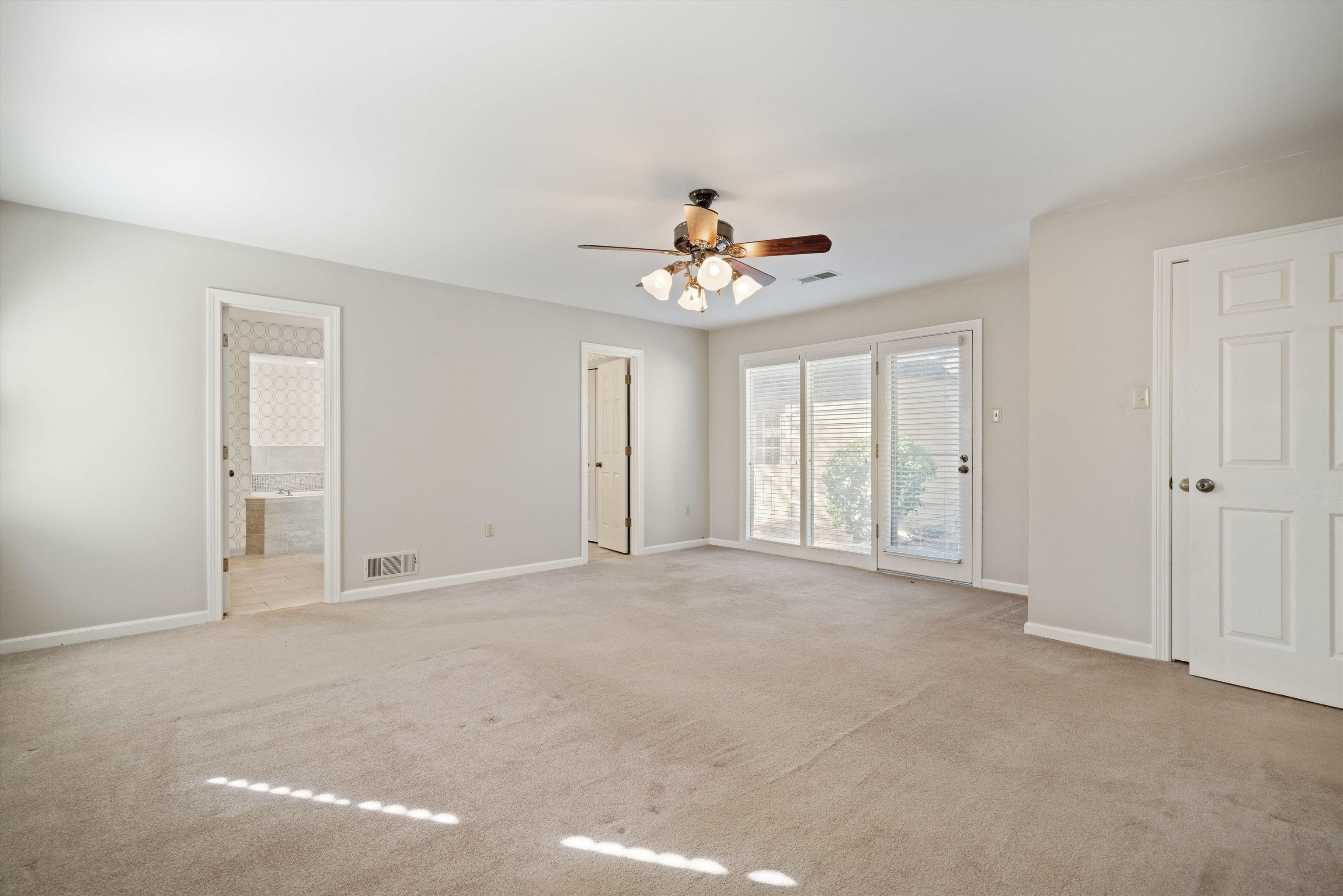 7781 Foster Ridge Road Germantown, TN 38138 - Photo 12 of 26 Spare room with ceiling fan and light colored carpet