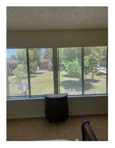 a living room with large windows
