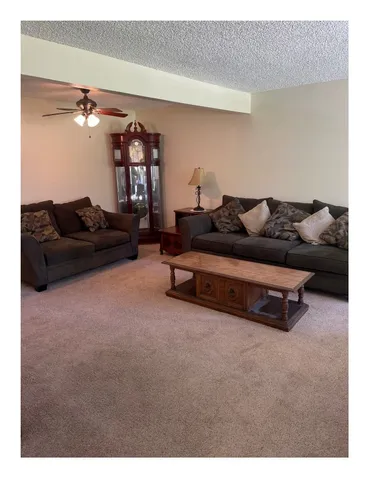 a living room with furniture and a couch