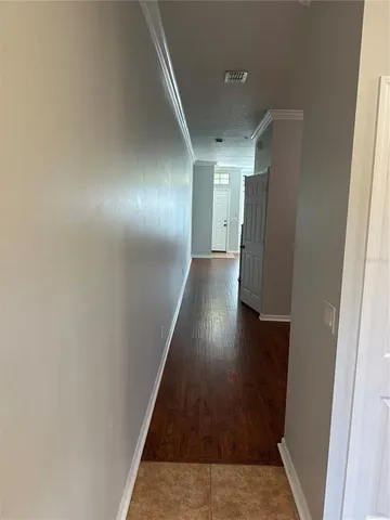 a view of gallery with wooden floor