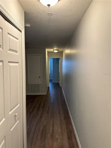 a view of gallery with wooden floor