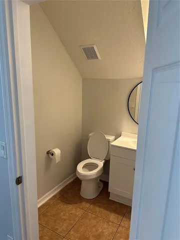 a bathroom with a toilet and a sink