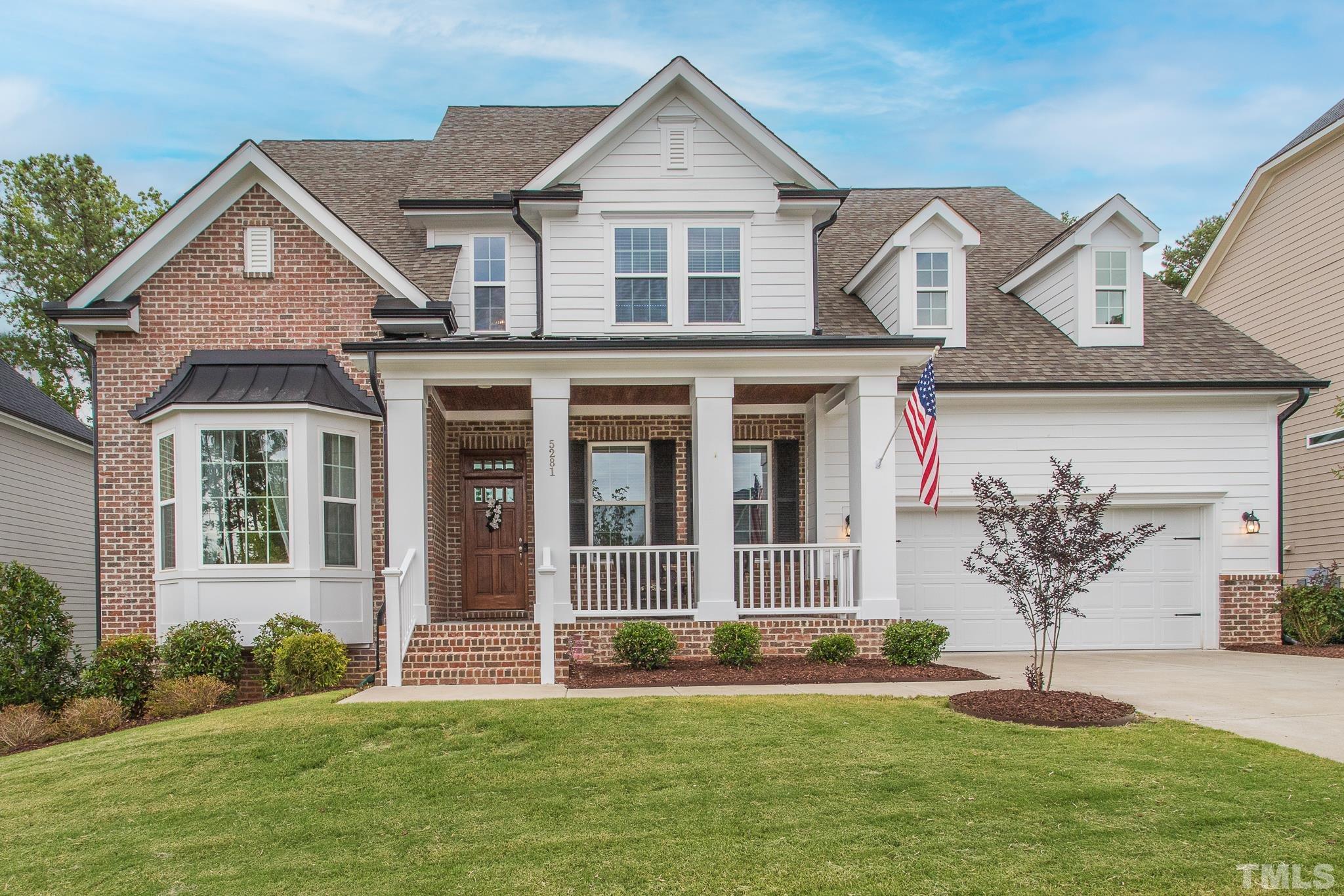 5281 Aleppo Lane Raleigh, NC 27613 - Photo 1 of 57 a front view of a house with a yard
