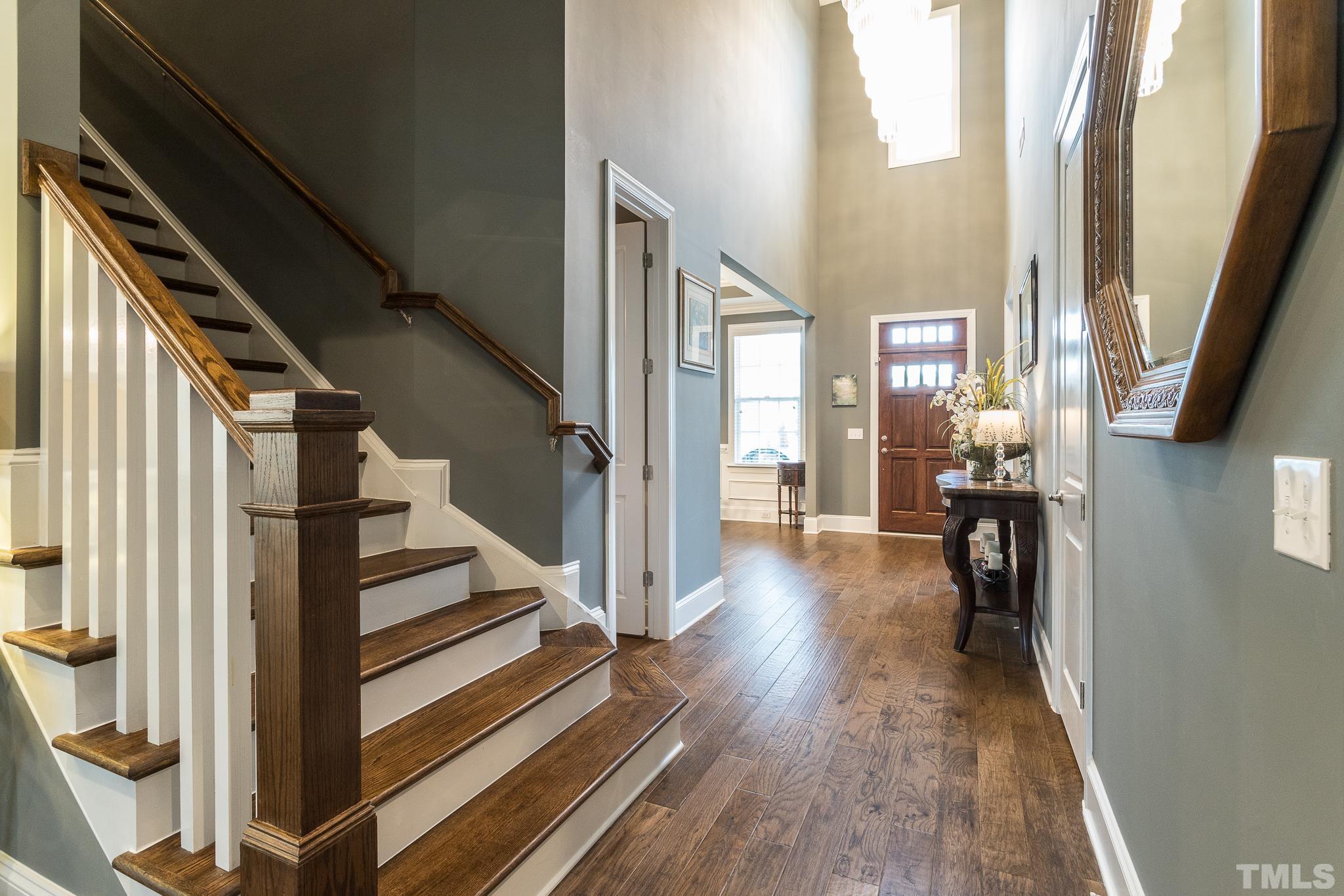 5281 Aleppo Lane Raleigh, NC 27613 - Photo 15 of 57 a view of entryway and hall with wooden floor