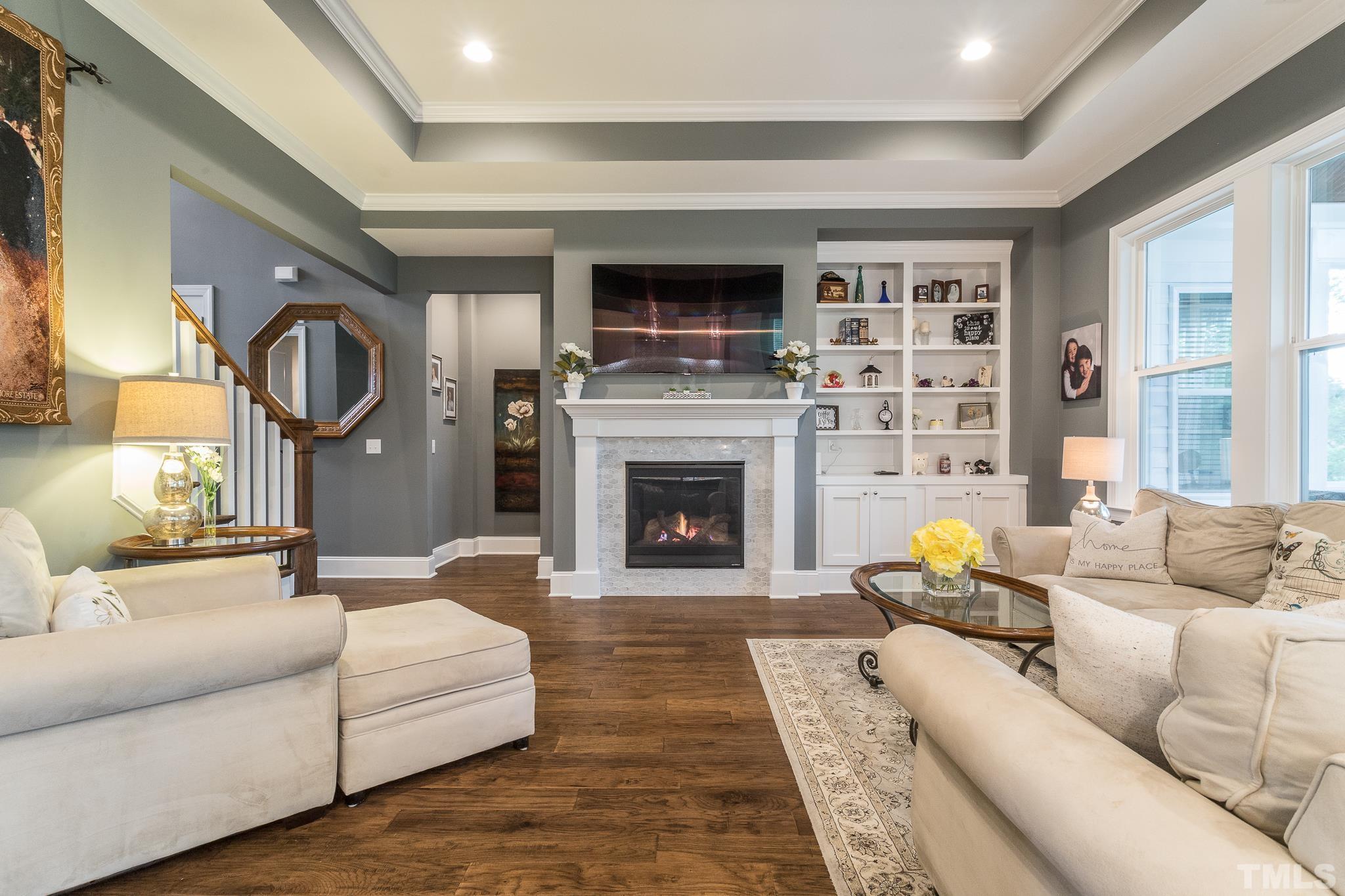 5281 Aleppo Lane Raleigh, NC 27613 - Photo 16 of 57 a living room with furniture and a fireplace