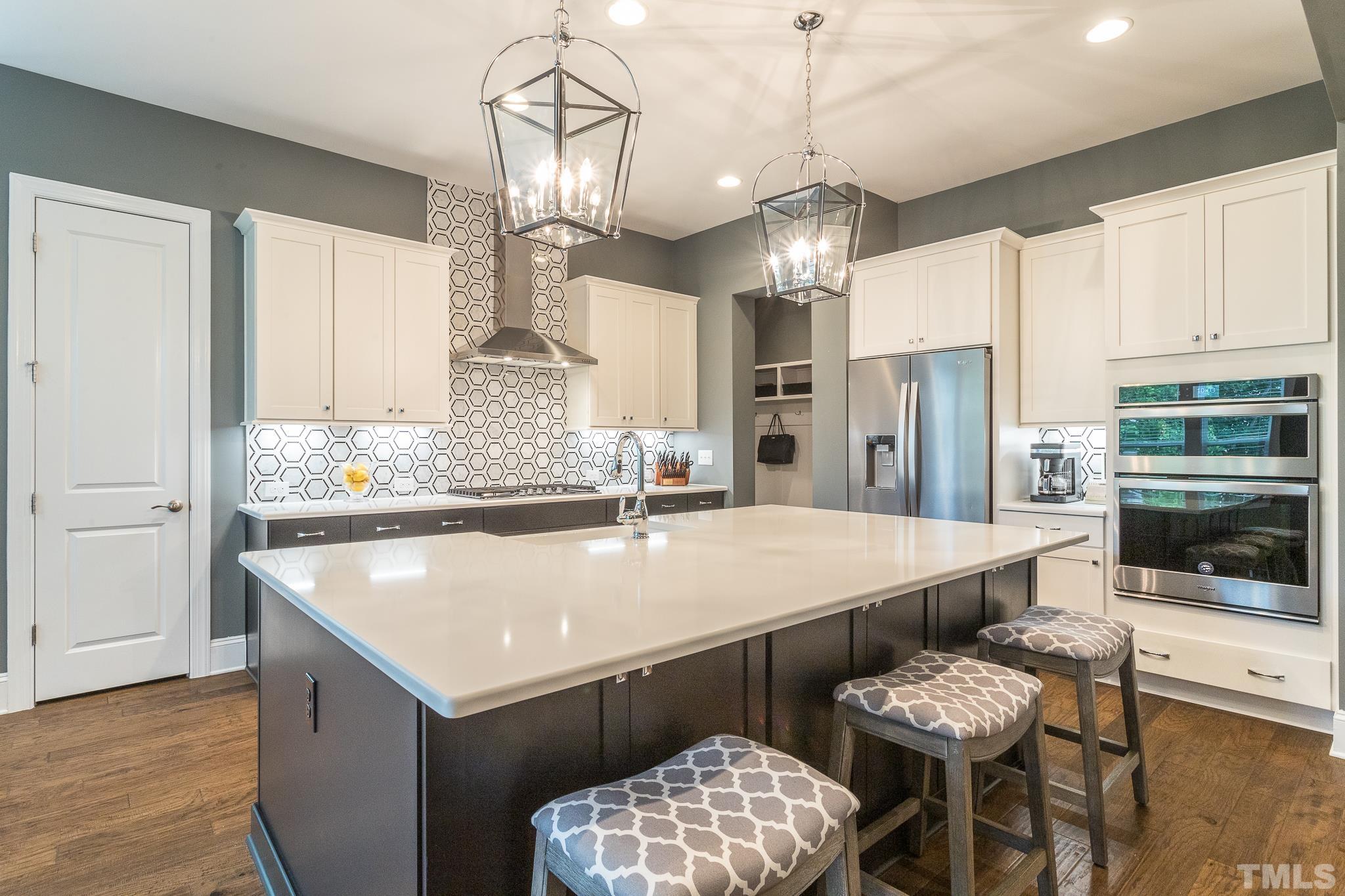 5281 Aleppo Lane Raleigh, NC 27613 - Photo 18 of 57 a large kitchen with a table and chairs