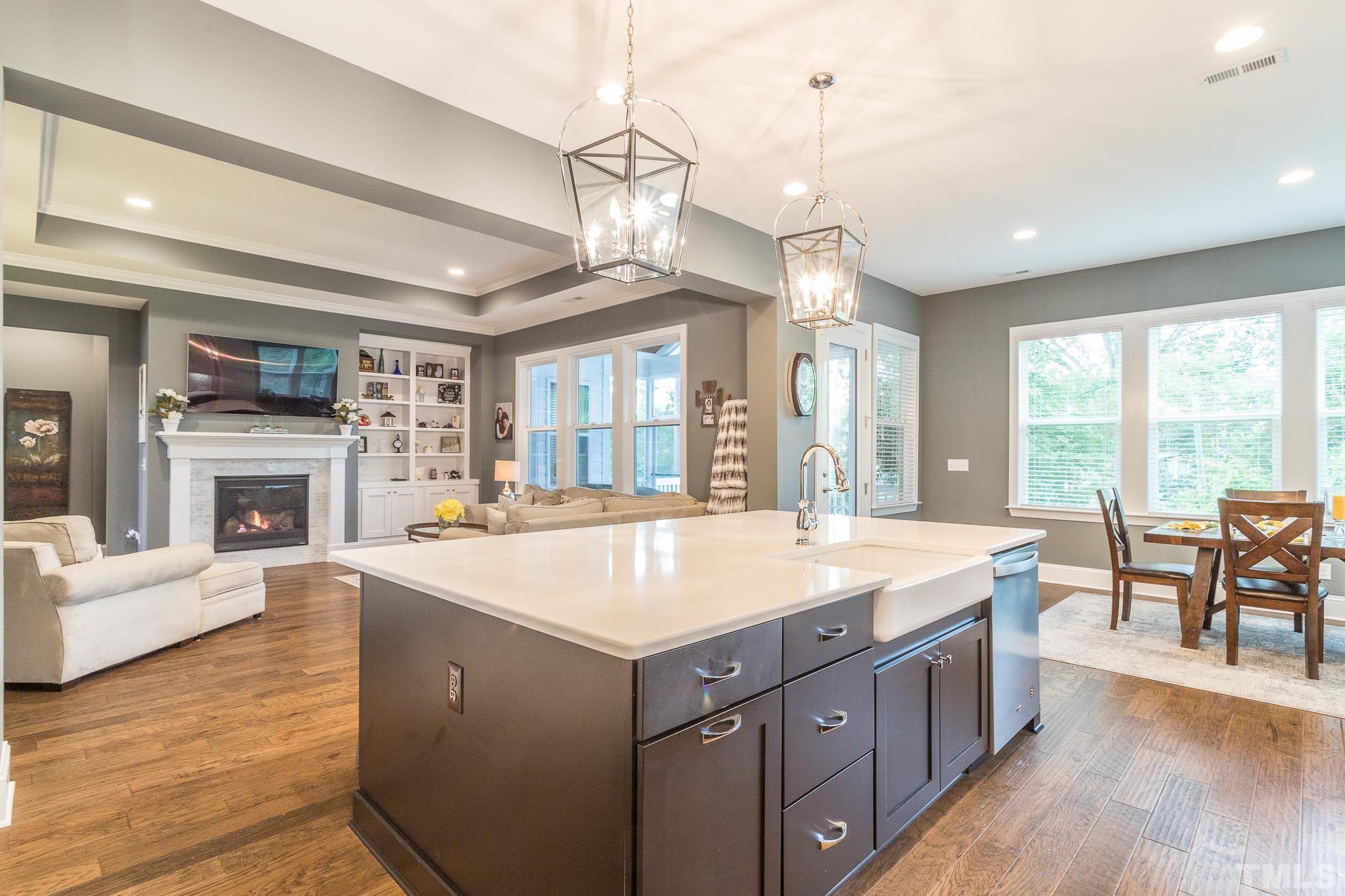 5281 Aleppo Lane Raleigh, NC 27613 - Photo 20 of 57 a large kitchen with kitchen island a large island in it