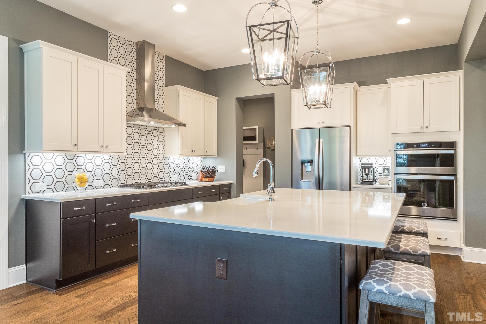 5281 Aleppo Lane Raleigh, NC 27613 - Photo 23 of 57 a kitchen with stainless steel appliances granite countertop a sink refrigerator and cabinets